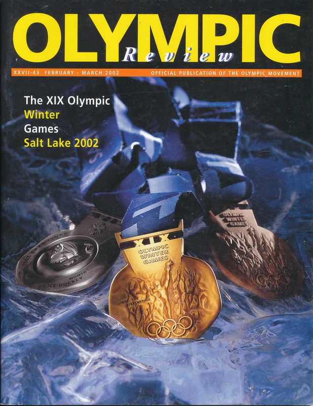 Ein Buch mit dem Titel "Olympische Übersicht" mit mehreren Medaillen und fetter Schrift auf dem Cover.
