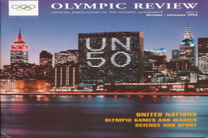 Buch mit dem Titel "Olympische Überprüfung Offizielle Veröffentlichung der Olympischen Bewegung" mit einem Stadtbild auf dem Cover, das auf einer flachen Oberfläche liegt.