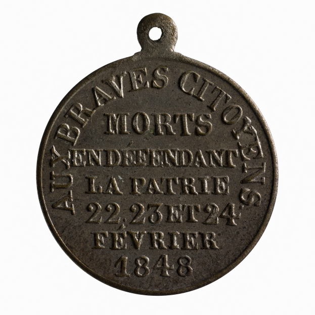 Eine Bronzemedaille mit der Inschrift "Braves City Morts" auf einem weißen Hintergrund.